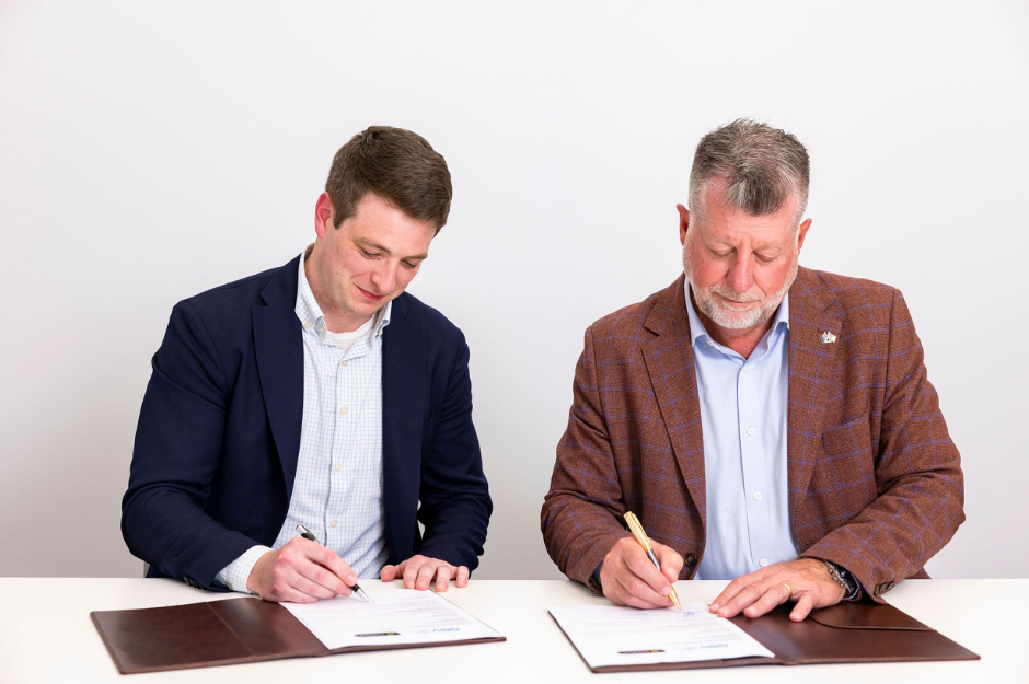 Ben New (Managing Director, GSV) and Tim Stollznow (CEO, MyVenue) signing