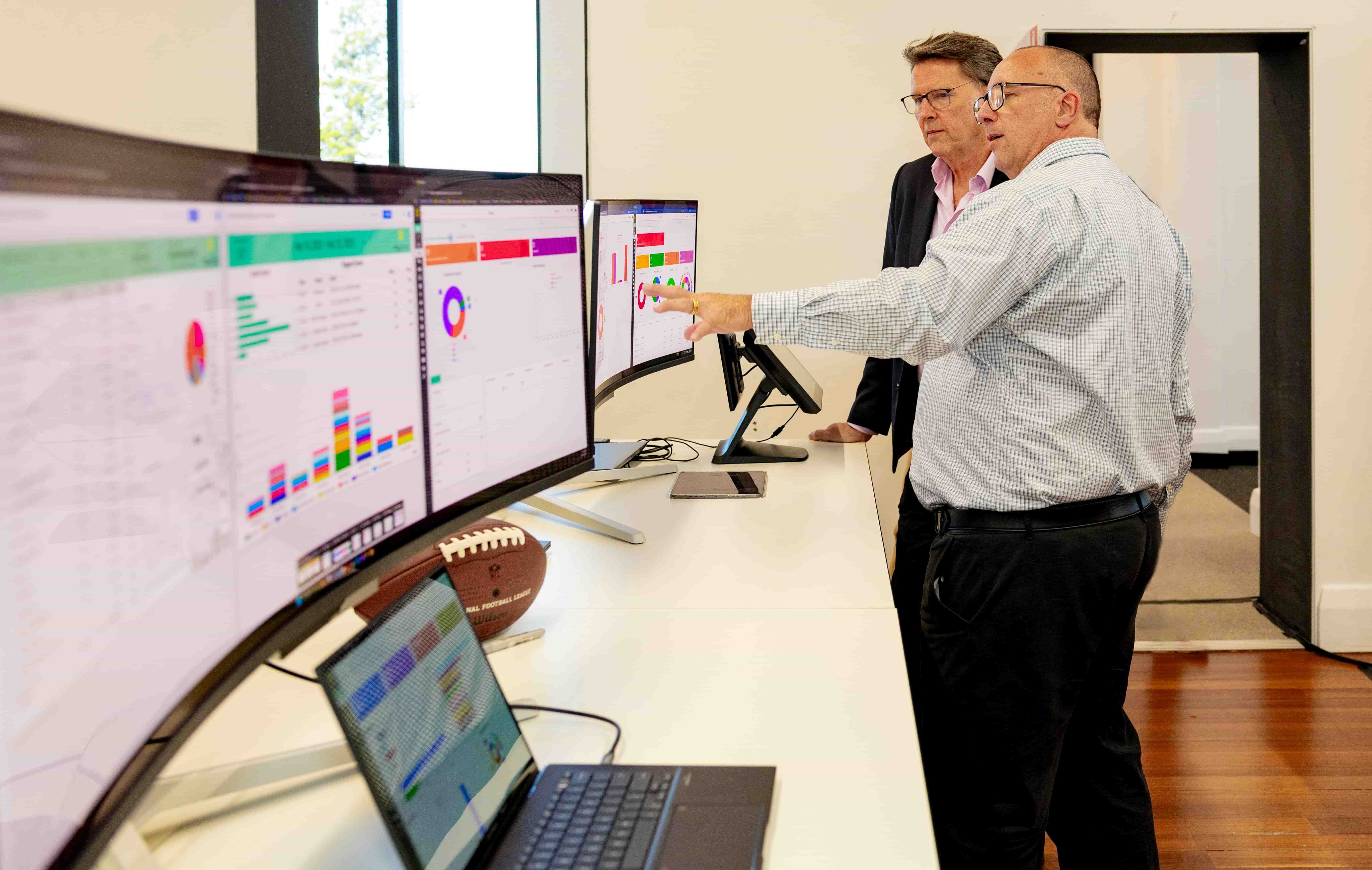 MyVenue team member demonstrating the MyVenue reporting dashboards.
